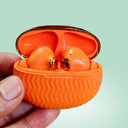 ADNAN MOBILE SHOP EarBuds 6 in bright orange with gold accents, held in a hand against a light green background.